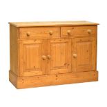 Modern waxed pine dresser base of two drawers over three fielded panelled cupboard doors, 122cm x