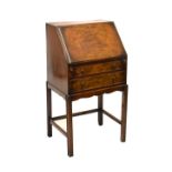 Early 20th Century mahogany and walnut veneered bureau fitted two drawers, 53cm wide Condition: