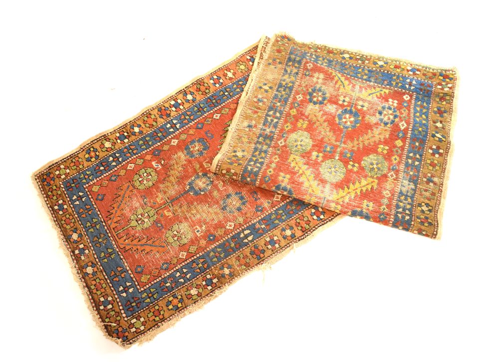 Early to mid 20th Century Caucasian wool runner, the brick-red field with flowering plant motif