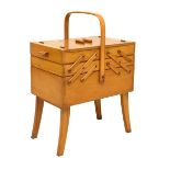 Beech concertina sewing box, 46cm wide Condition: Wear and discolouration to the loop handle. **