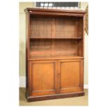 Late Victorian/Edwardian mahogany open bookcase of adjustable shelves with panelled cupboards