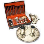 Silver-plated three-piece tea set, and a circular tray, together with a canteen of stainless steel