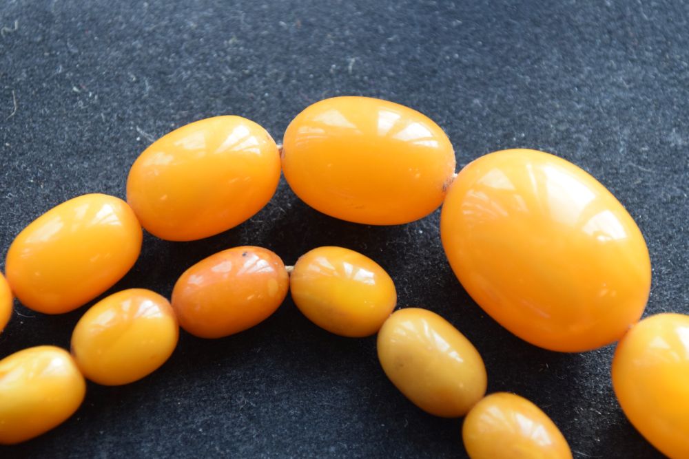 Graduated string of amber beads, 84cm long approx, 52g approx Condition: **Due to current lockdown - Image 7 of 8