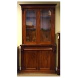 Victorian mahogany glazed bookcase on cupboard in two sections, 104cm wide x 39cm deep x 197cm