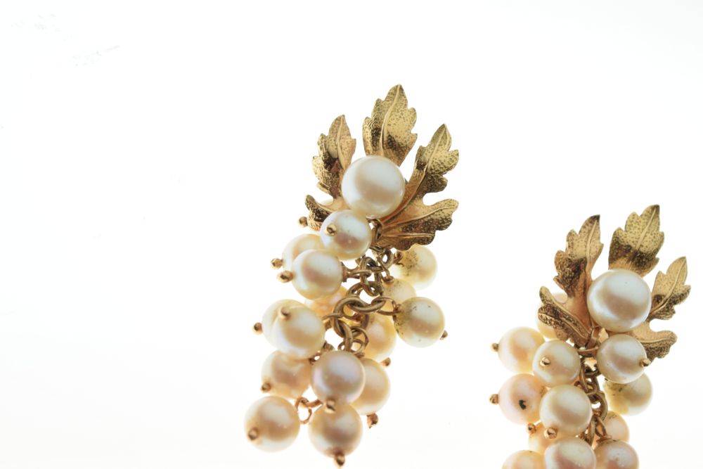 Pair of unmarked yellow metal and cultured pearl ear studs of leaf design, the pearl drops formed as - Image 2 of 5