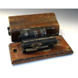 Early wooden cased Britannic Guy's calculating machine Condition: General wear commensurate with age