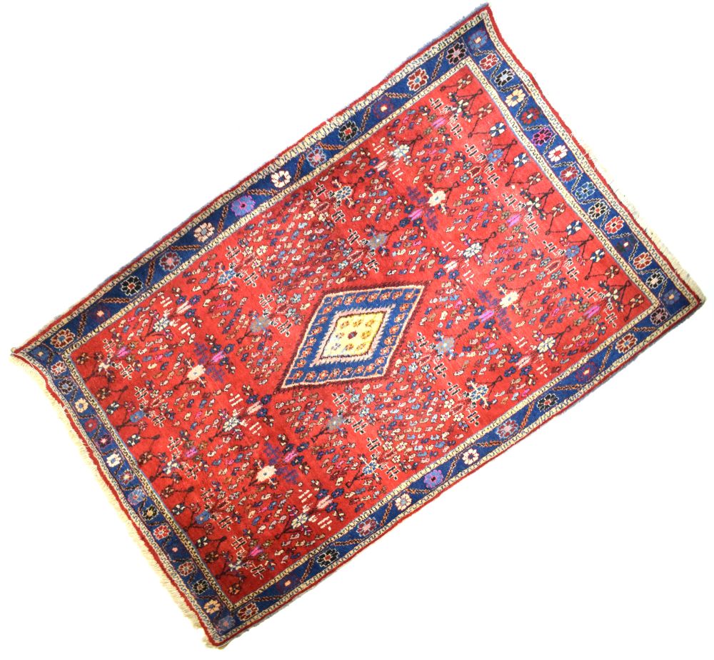 Middle Eastern wool rug, probably North West Persia, the bright red field with all-over boteh, 160cm