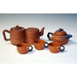 Two Chinese Yixing red stone ware tea pots, together with three tea cups (5) Condition: Light