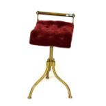 Victorian brass music stool on tripod base having upholstered button-back seat Condition: The x-
