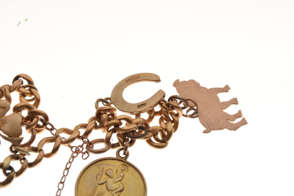 18ct gold curb link bracelet set with assorted gold and yellow metal charms and a plated padlock, - Image 5 of 5