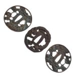 Three Japanese cast metal tsuba, 7cm diameter and smaller Condition: Some discolouration,