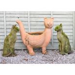 Pair of composite 'stone' garden ornaments in the form of cats, together with a terracotta planter