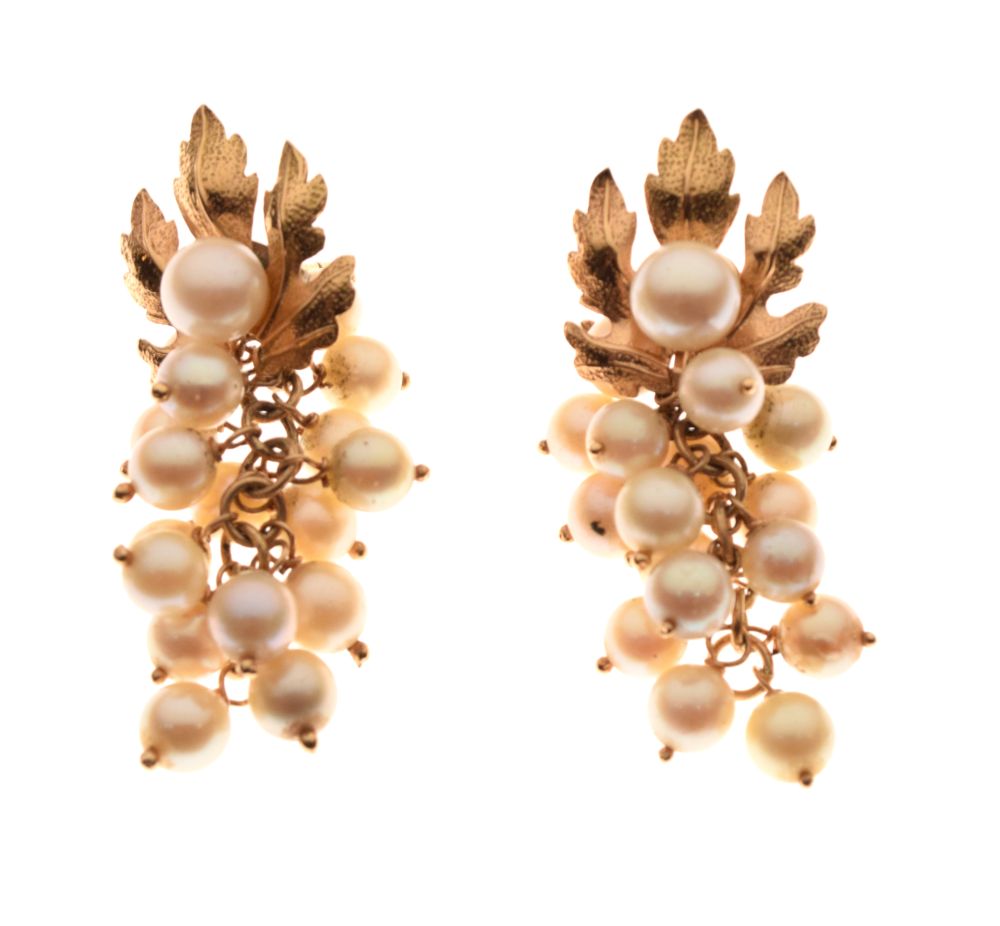 Pair of unmarked yellow metal and cultured pearl ear studs of leaf design, the pearl drops formed as