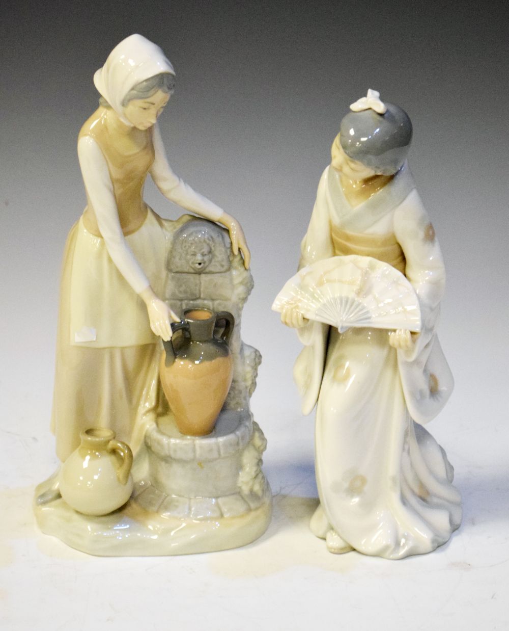 Two Nao porcelain figures, tallest 28cm high Condition: We endeavour to mention any post-