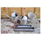 Two watering cans, two trough feeders and a bucket Condition: Sold as per images - **Due to