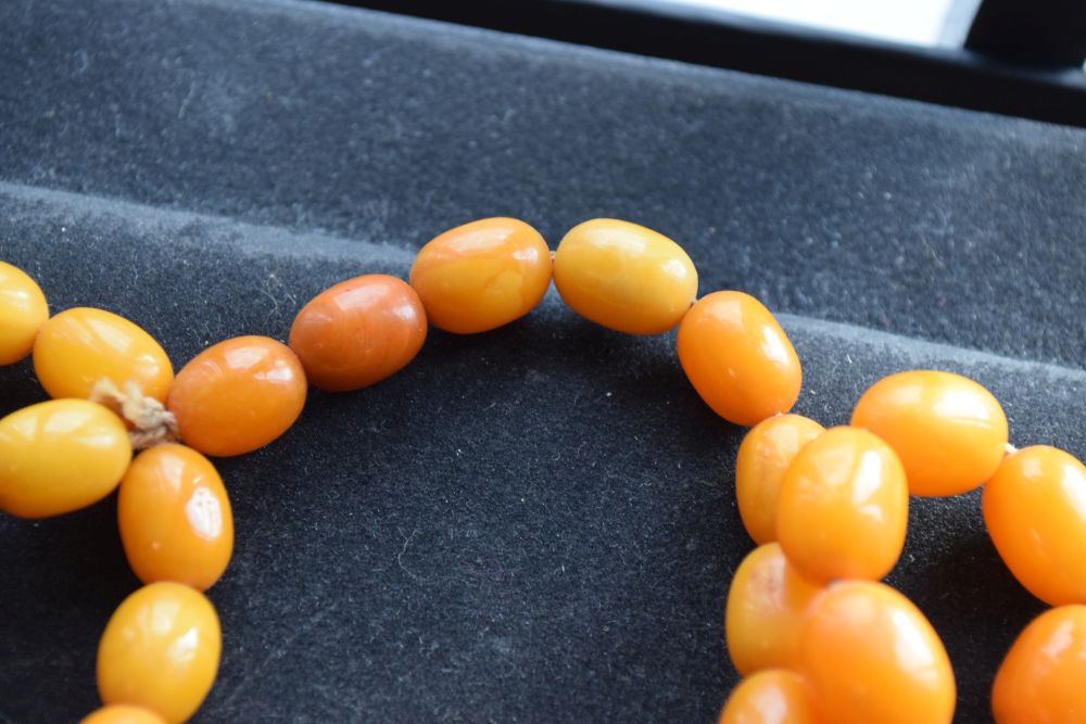 Graduated string of amber beads, 84cm long approx, 52g approx Condition: **Due to current lockdown - Image 5 of 8