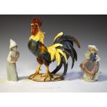 Two Lladro porcelain figures, together with a pottery cockerel, 30cm high Condition: various