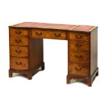 Old reproduction walnut-veneered twin pedestal desk of inverted breakfront form, 116cm x 57cm x 75cm