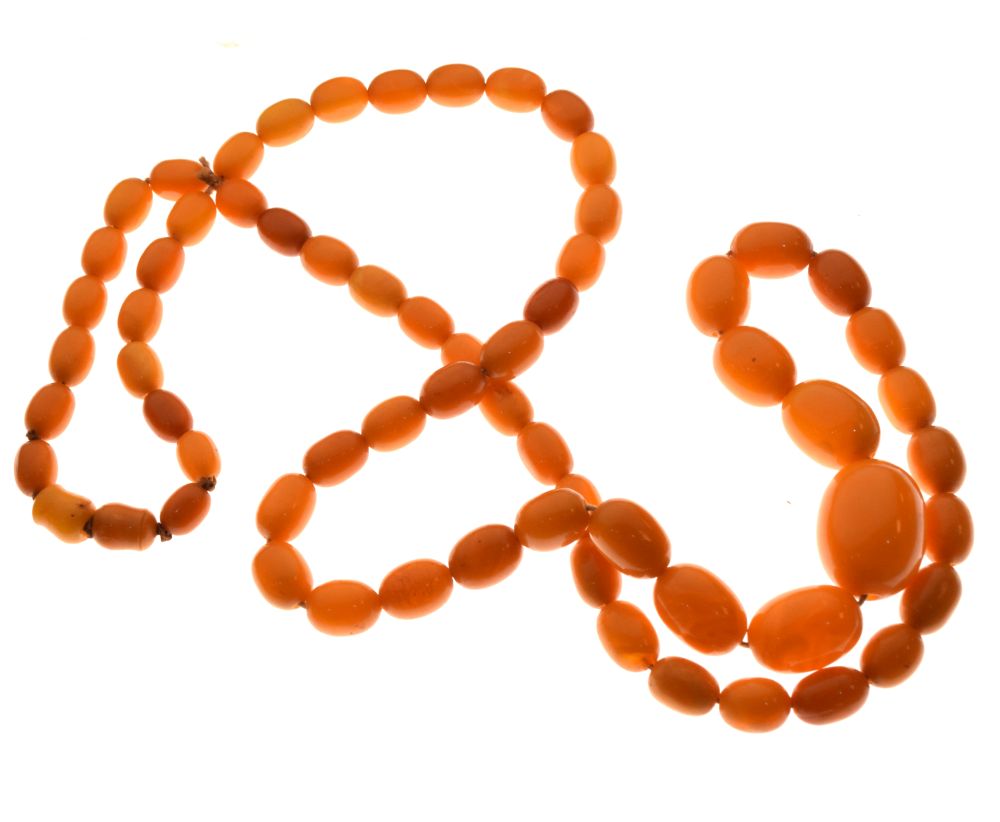 Graduated string of amber beads, 84cm long approx, 52g approx Condition: **Due to current lockdown