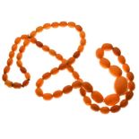 Graduated string of amber beads, 84cm long approx, 52g approx Condition: **Due to current lockdown