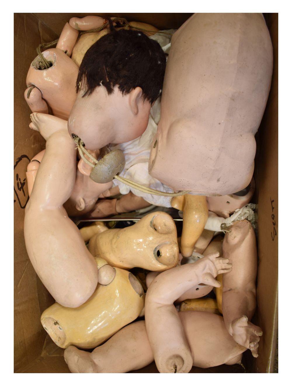 Quantity of mainly bisque headed dolls and parts Condition: Majority of dolls appear complete,