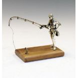 Late 20th Century white metal figure of a fisherman standing on a wooden base stamped 925, 8.75cm