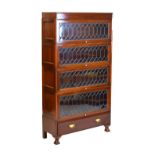Early 20th Century mahogany modular bookcase of four sections with lead glazing on paw feet, in