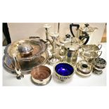 Quantity of silver plated items to include tea set, candlesticks, wine coaster, etc Condition: