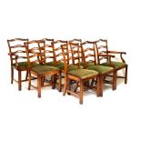 Suite of reproduction mahogany Hepplewhite style ladder back chairs (two carvers, six standards)