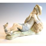 Lladro figure of a boy reclining against a wood pile Condition: We endeavour to mention any post-