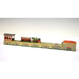German tin plate clockwork operated model train with railway track, 38cm long Condition: Chips in