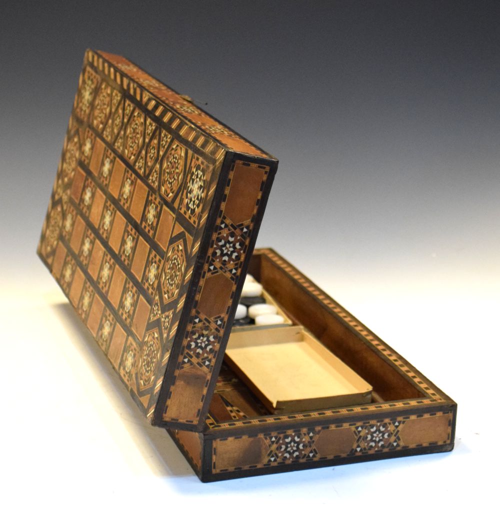 Middle Eastern backgammon board, with inlaid decoration, 40cm wide Condition: Damage to the inlaid
