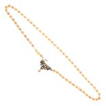 String of cultured pearls with Art Deco-style white metal clasp stamped 585, 51cm long Condition: