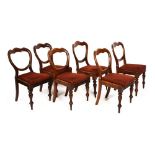 Six Victorian mahogany balloon back dining chairs with drop-in seats Condition: All chairs with