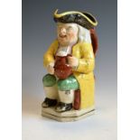 Staffordshire 'Jolly Toby' pottery ale jug, 24cm high Condition: Overall wear to enamels, minor