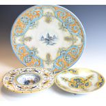 Reproduction Italian maiolica tin glazed charger and two other plates similar, 39cm diameter and