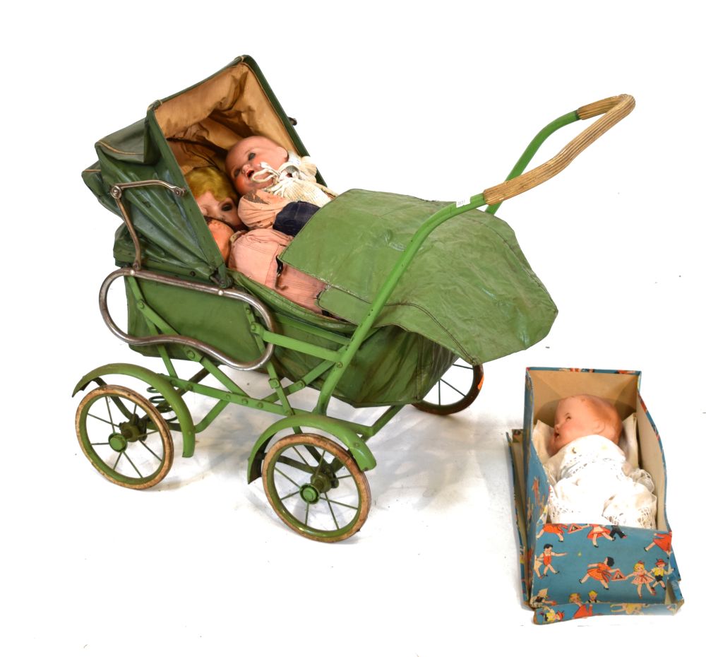 Vintage child's pram, in green, together with assorted group of bisque and other headed dolls
