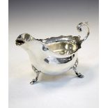 Edward VII silver sauce boat with shaped rim and standing on three hoof feet, Sheffield 1903, 200g