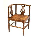 19th Century fruitwood lyre back corner chair with woven rush seat Condition: Water damage, fading