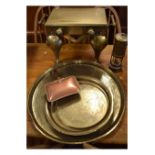 Brass footman, together with three Eastern brass trays, copper warming dish and a miner's safety