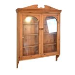 Stripped pine wall cabinet, 96cm x 19cm x 127cm high Condition: Central section of pediment detached