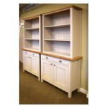 Pair of Marks & Spencer 'Padstow' bookcases on cupboards, 110cm x 41cm x 195cm high Condition: **Due