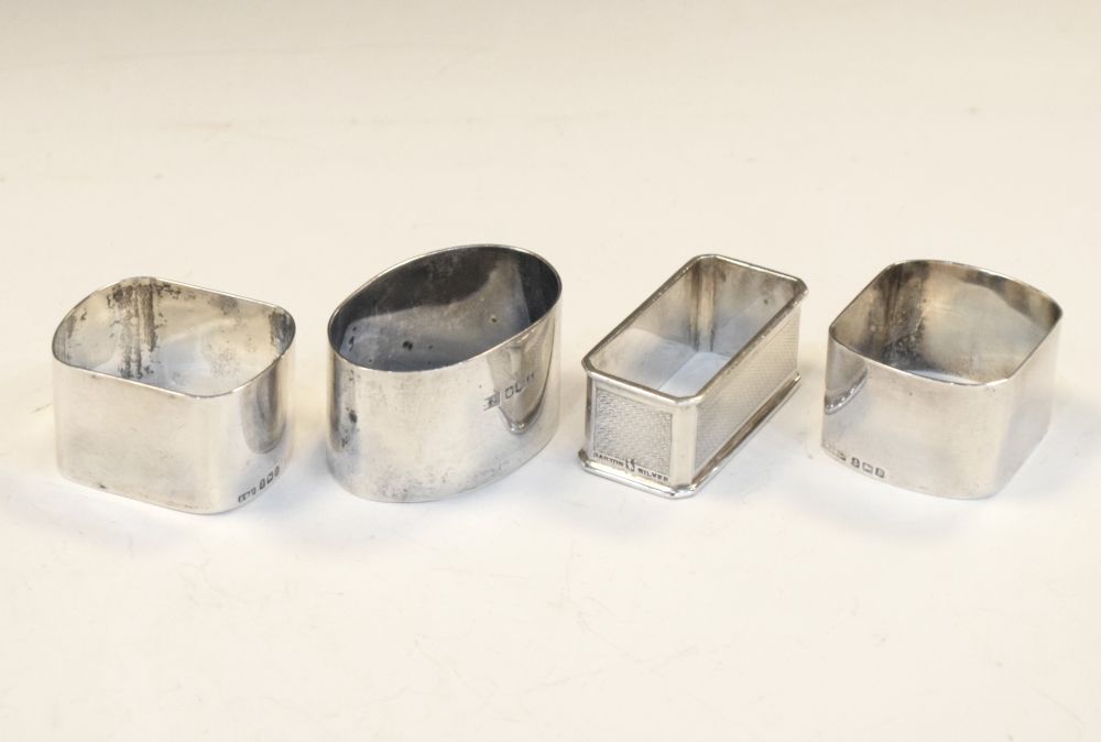 Pair of George V silver napkin rings, Birmingham 1926, together with two other napkin rings, 110g