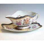 Samson porcelain sauce boat and stand of 18th Century Chinese armorial style, 24cm long overall