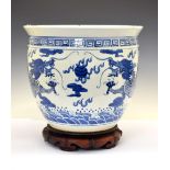 Chinese blue and white porcelain fish bowl or planter, 38cm diameter x 32cm high, with wooden