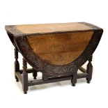 Oak gateleg table with carved border, 116cm wide Condition: Top is a little pale and would benefit