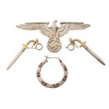 Third Reich-style unmarked metal cap or shoulder badge with eagle and swastika, pair of bayonet