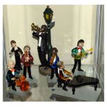 Czech glass novelty jazz band of six figures, and a cast resin figure of a trumpeter, 25cm high (