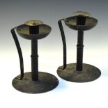 Pair of metal candlesticks in the manner of Christopher Dresser, 20cm high Condition: Signs of rust,