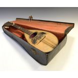 Early 20th Century mandolin, bears label to the inside for Giuseppe Casini, in travelling case